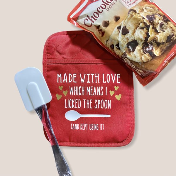 Red Potholder that says "made with love, which means I licked the spoon (and kept using it)